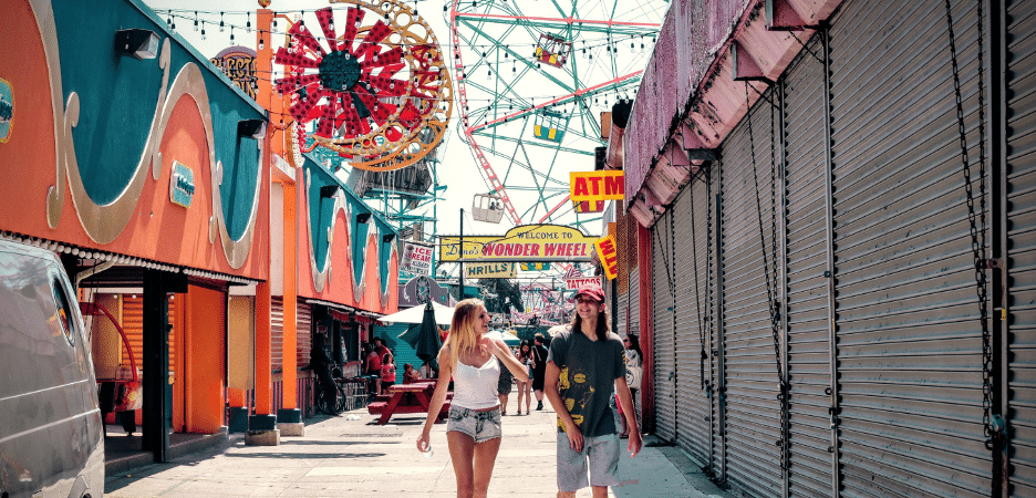 two women walking through a fair